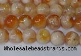 CAA1071 15.5 inches 6mm round sakura agate gemstone beads