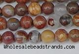 CAA1221 15.5 inches 6mm round gold mountain agate beads