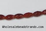 CAA124 15.5 inches 6*10mm faceted rice red agate gemstone beads