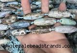 CAA2755 15.5 inches 12*38mm - 14*40mm rice agate beads wholesale