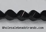 CAB336 15.5 inches 10*14mm faceted & twisted rice black agate beads