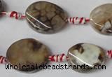 CAG1576 15.5 inches 15*20mm twisted oval fire crackle agate beads