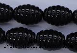 CAG1693 15.5 inches 15*20mm carved rice black agate beads