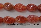 CAG4184 15.5 inches 6*10mm twisted rice natural fire agate beads