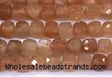 CCU885 15 inches 4mm faceted cube sunstone beads