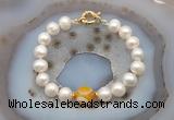 CFB1037 Hand-knotted 9mm - 10mm potato white freshwater pearl & yellow banded agate bracelet