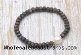 CFB754 faceted rondelle bronzite & potato white freshwater pearl stretchy bracelet