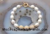 CFB946 Hand-knotted 9mm - 10mm rice white freshwater pearl & white fossil jasper bracelet