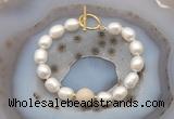 CFB968 Hand-knotted 9mm - 10mm rice white freshwater pearl & white fossil jasper bracelet