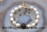 CFB978 Hand-knotted 9mm - 10mm rice white freshwater pearl & black lava bracelet