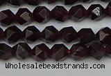 CNG7275 15.5 inches 6mm faceted nuggets red garnet beads