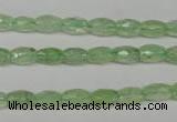 CRU165 15.5 inches 5*8mm faceted rice green rutilated quartz beads