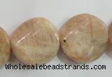 CSS256 15.5 inches 20mm twisted coin natural sunstone beads