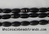 CTO116 15.5 inches 5*10mm faceted rice black tourmaline beads