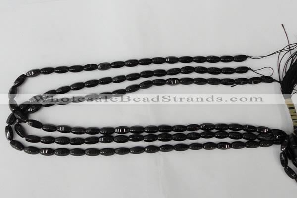 CTO116 15.5 inches 5*10mm faceted rice black tourmaline beads