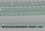 CTU2571 15.5 inches 4mm faceted round synthetic turquoise beads